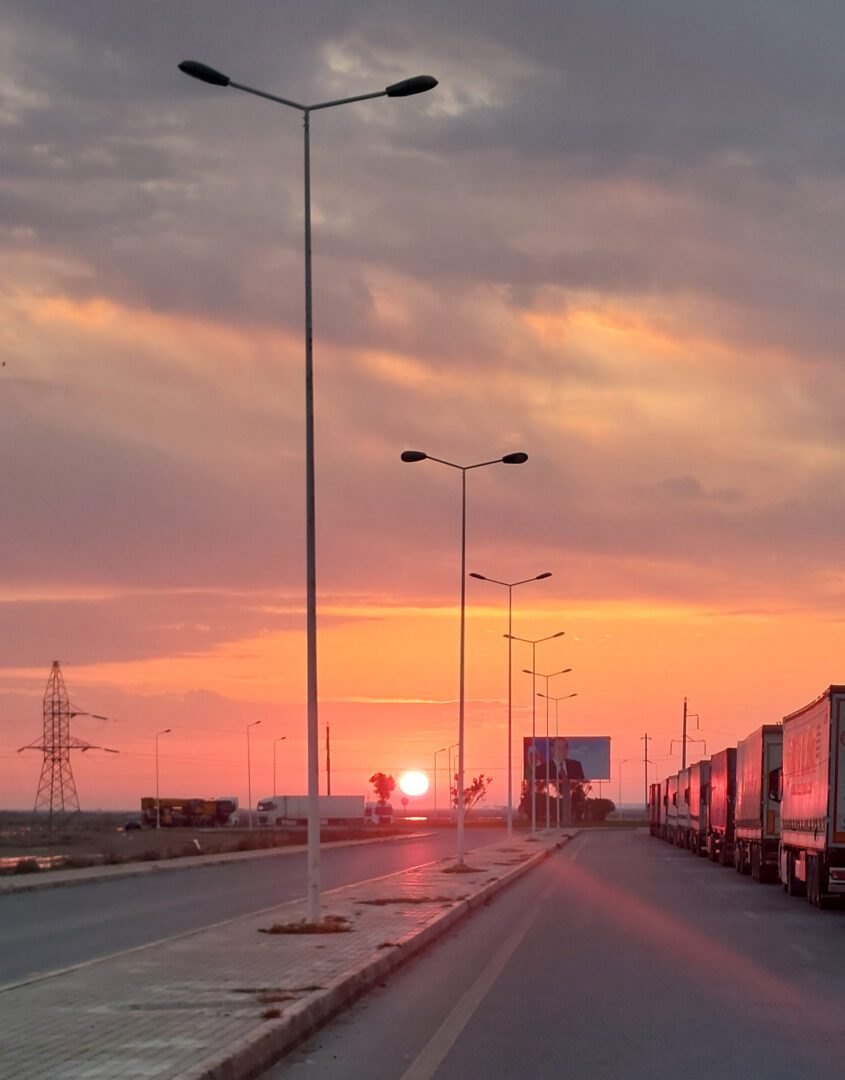 Alat, Azerbaijan, 12 April 2026: trucks queue for the Caspian ferry at sunset